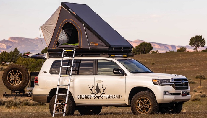 This photo features Colorado Overlander's Toyota Land Cruiser equipped with a rooftop tent and camping gear.