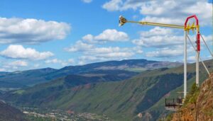 This photo captures the thrilling experience of a theme-park ride atop Glenwood Caverns Adventure Park, perched on the mountain's edge, offering a view of the charming town of Glenwood Springs.