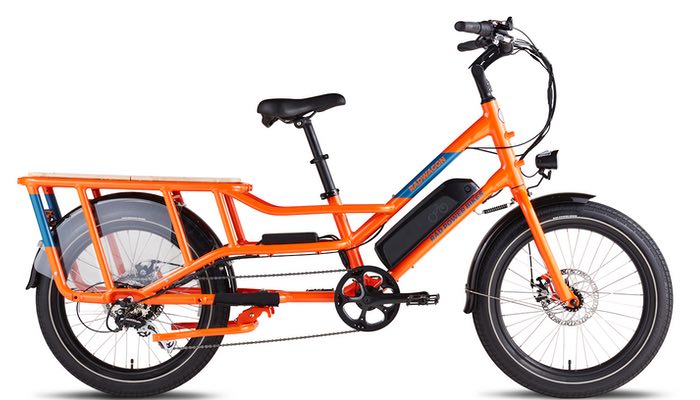In this image, a striking orange Rad Wagon E-bike from Hanging Lake Adventure Co-op and Glenwood Canyon Bikes.