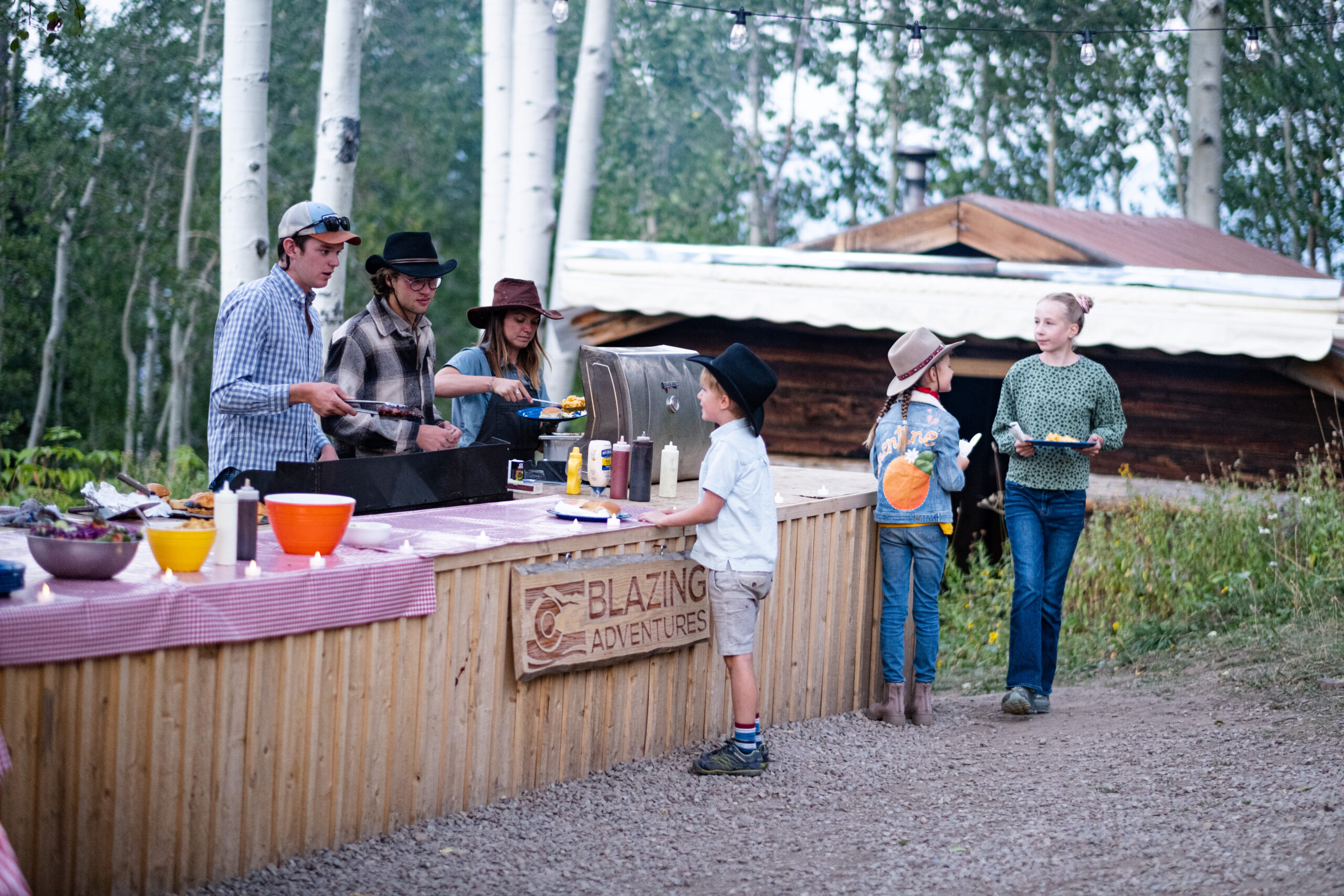 Image of a family enjoying the Blazing Adventure Sunset Dinner on Snowmass Mountain