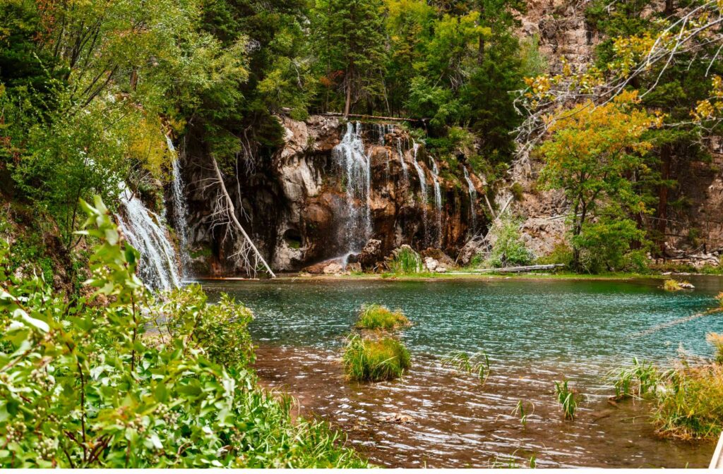 View of Hanging Lake from the top of the stairs looking towards water fall.