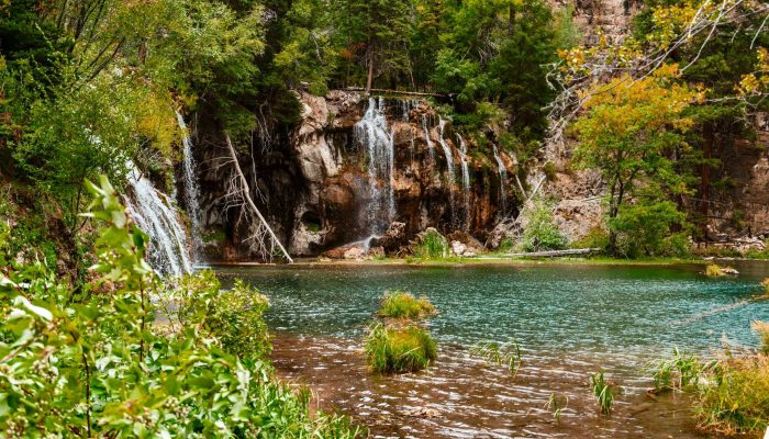 View of Hanging Lake from the top of the stairs looking towards water fall.